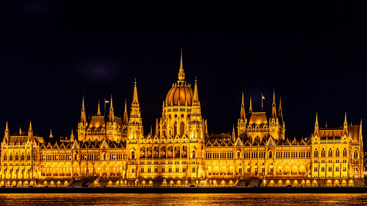 gallery-01 Illuminated Hungarian Parliament Building at night on the Danube waterfront. A must-see in Budapest, Hungary.